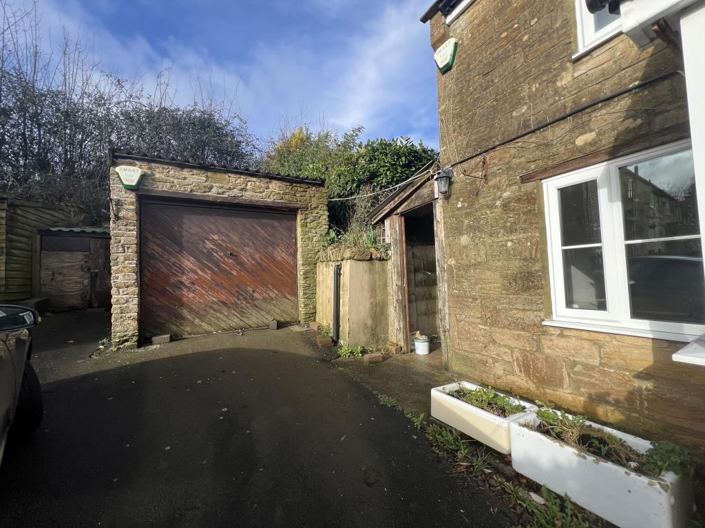 Lot: 131 - DETACHED COTTAGE FOR UPDATING - General view of garage and store